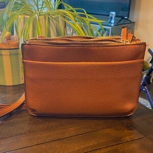 Kelly & Katie 10” X 7” vegan leather crossbody bag.